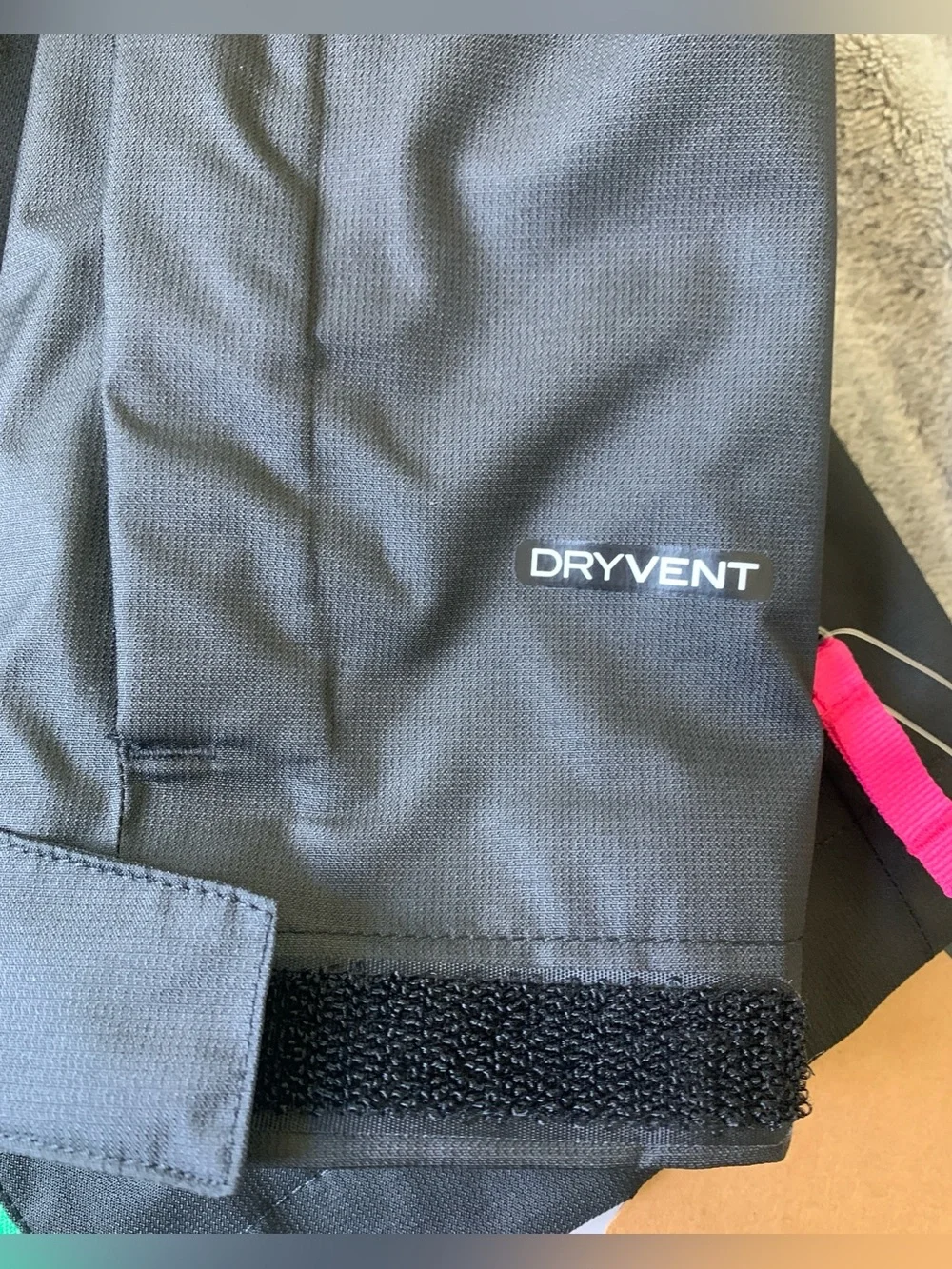 The North Face Black Hooded Jacket with Green Lining & Pink Zippers